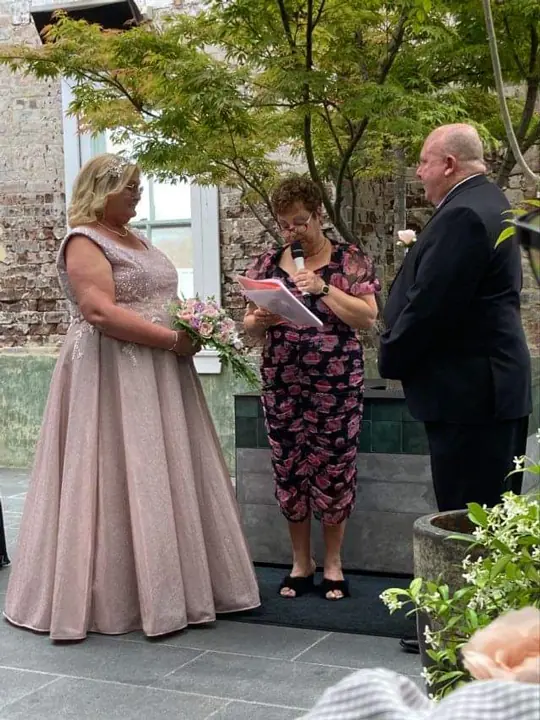 Josie with a bride and groom